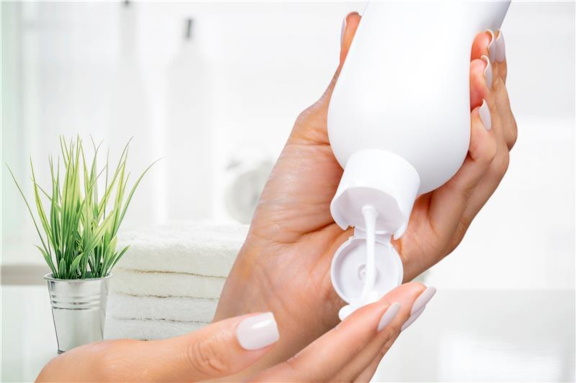 Squeezing lotion onto a hand