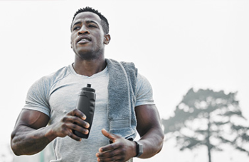 Cropped shot of a handsome young male athlete out for an early morning run