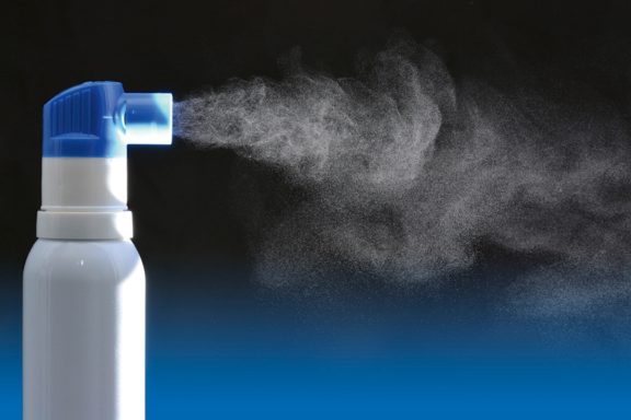 White and blue PureHale technology dispensing a fine mist of liquid formulation over a dark background from Aptar Pharma.