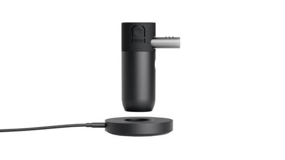 Side view of black cylindrical Aptar Kolibri NPLI above corded base used to deliver liquid droplets to lungs.