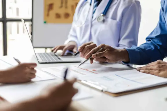 Healthcare professionals reviewing patient data to support digital studies and real-world evidence generation