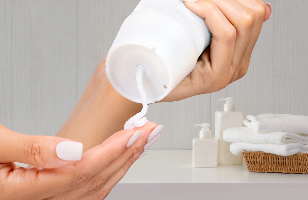 Simplicycle valve with lotion being squeezed onto female hand