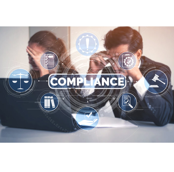 Man and woman at desk with laptops assessing the complex drug regulatory requirements for inhalers.